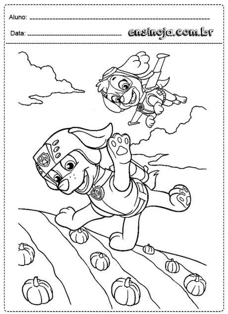 Desenho para colorir de dois cachorros em um campo com abóboras.